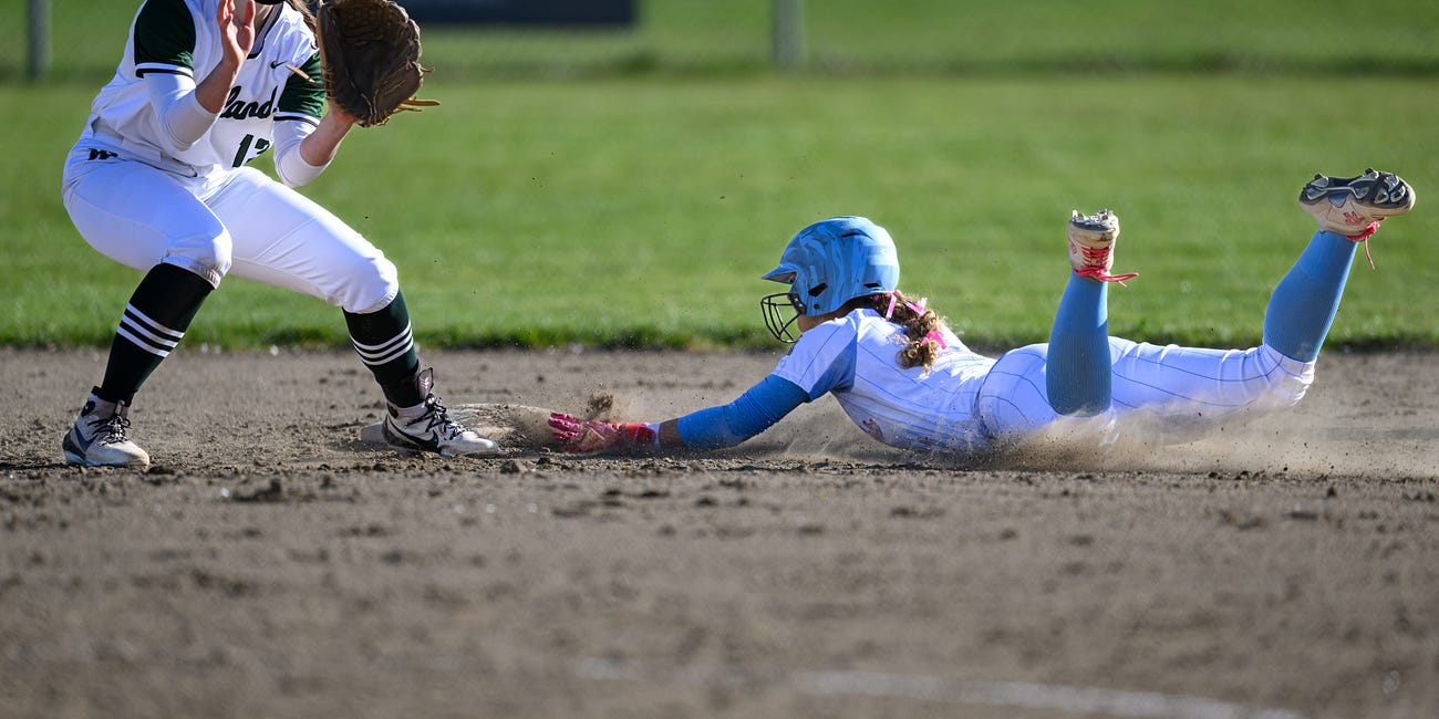 High School Softball: Mark Morris erupts early in league romp over Woodland