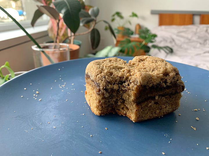 A glass pan of coffee cake cooling on a wire rack (left). A slice of coffee cake on a blue plate and with a bite taken out (sorry!) (right).