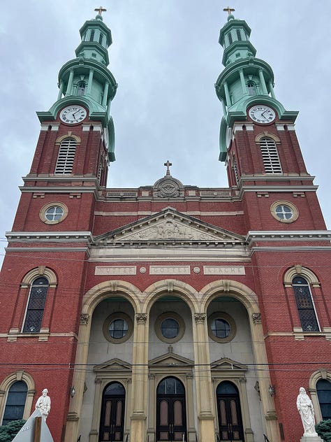Mural on Rosie's Social Club, Glockenspeil at Goebel Park, Goose Girl Fountain, Street sign reflecting WWII anti-German changes, statuary detail at Mother of God church, Mural of Mainstrasse, Cathedral Basilica, Strasse Haus