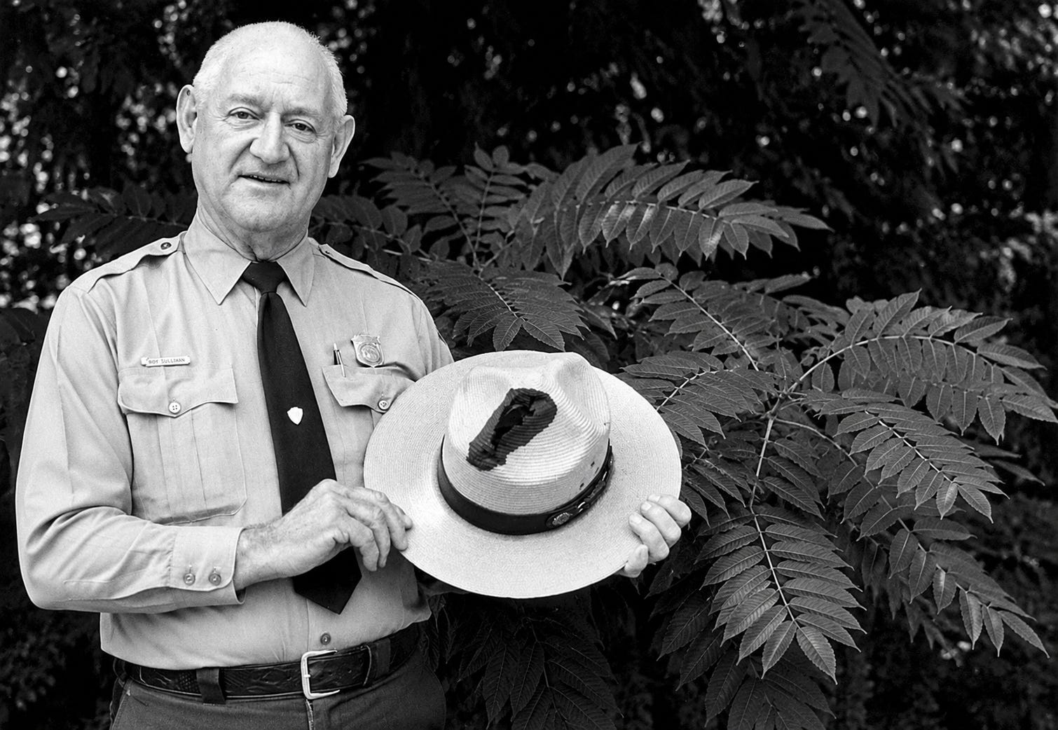 Roy Cleveland Sullivan (February 7, 1912 – September 28, 1983) was an American park ranger from Virginia who became famous for surviving seven recorded lightning strikes between 1942 and 1977, earning a place in Guinness World Records as the person struck by lightning more times than any other known individual. In this photograph, Sullivan holds his ranger hat, which bears a prominent burn mark left by one of the lightning strikes that made him a world-famous figure.