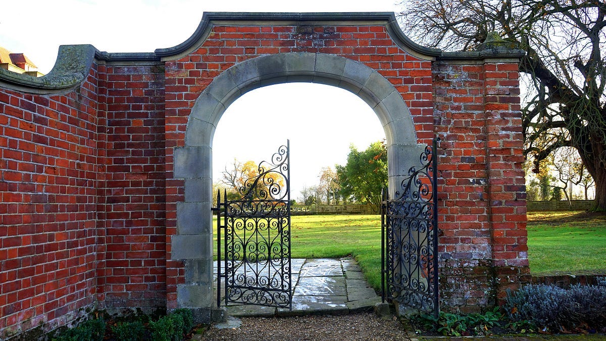 Gate by brick arch