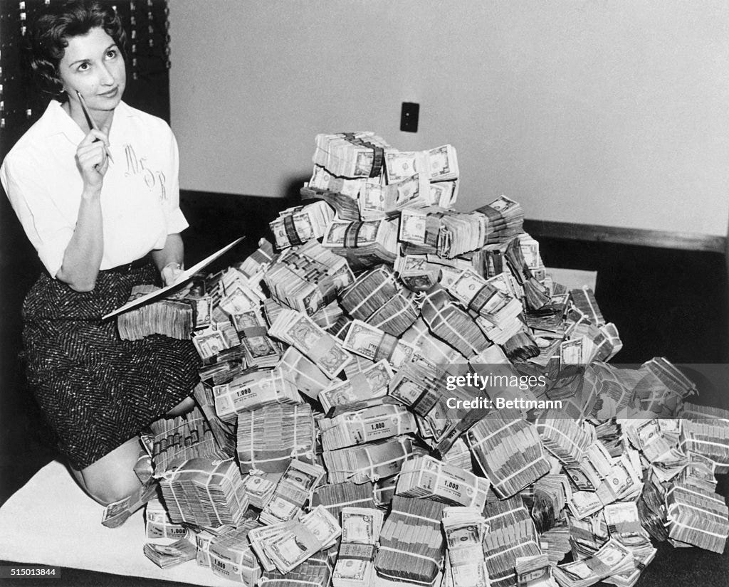 Bank Employee Sitting by a Million Dollars in Cash