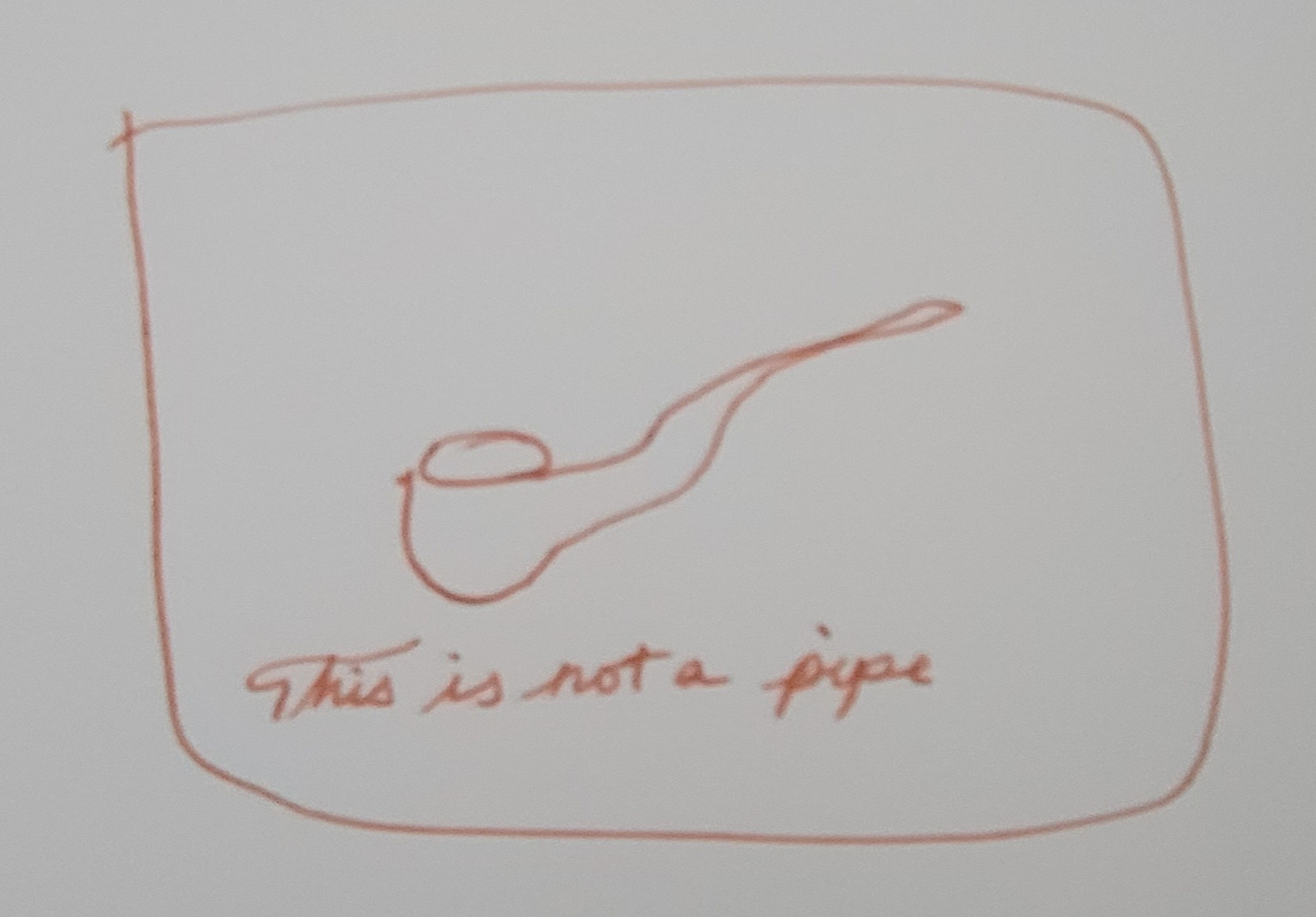 a rectangle with a drawing of a pipe. Along the bottom, "This is not a pipe"