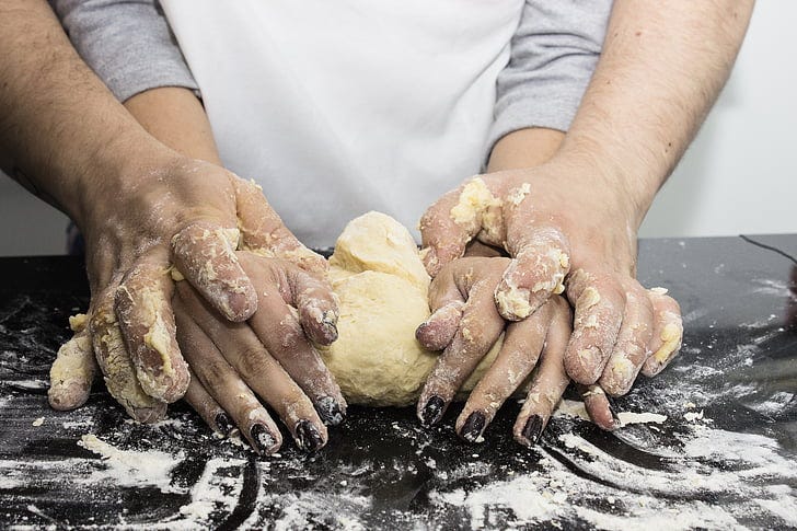 Royalty-Free photo: Person mixing dough | PickPik