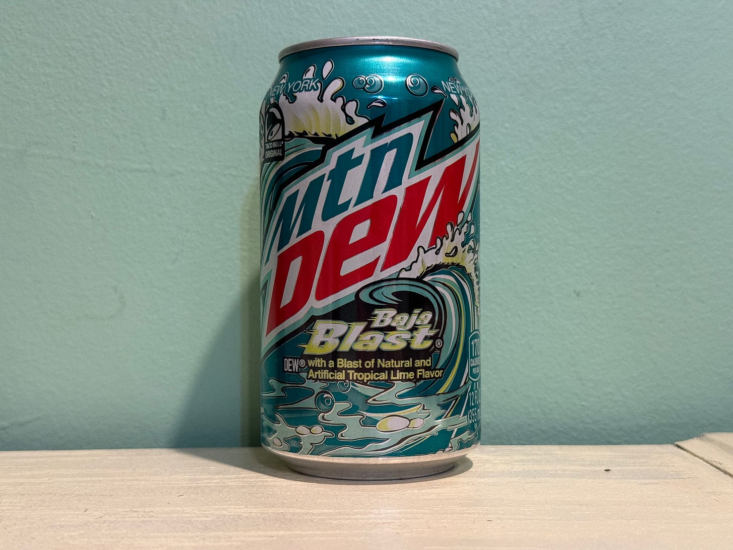 can of baja blast against a turquoise wall can of baja blast against a turquoise wall