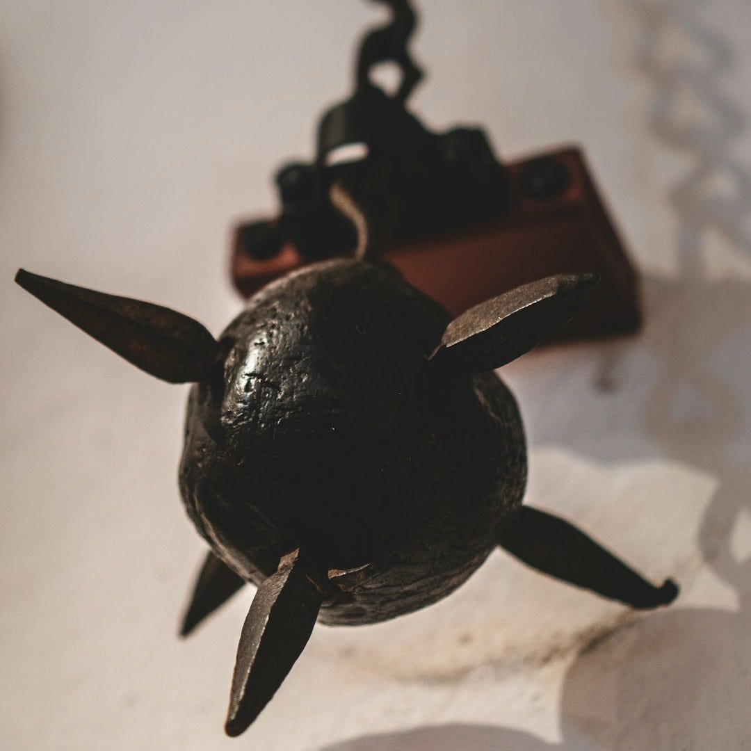 black dragon pendant on white textile black dragon pendant on white textile