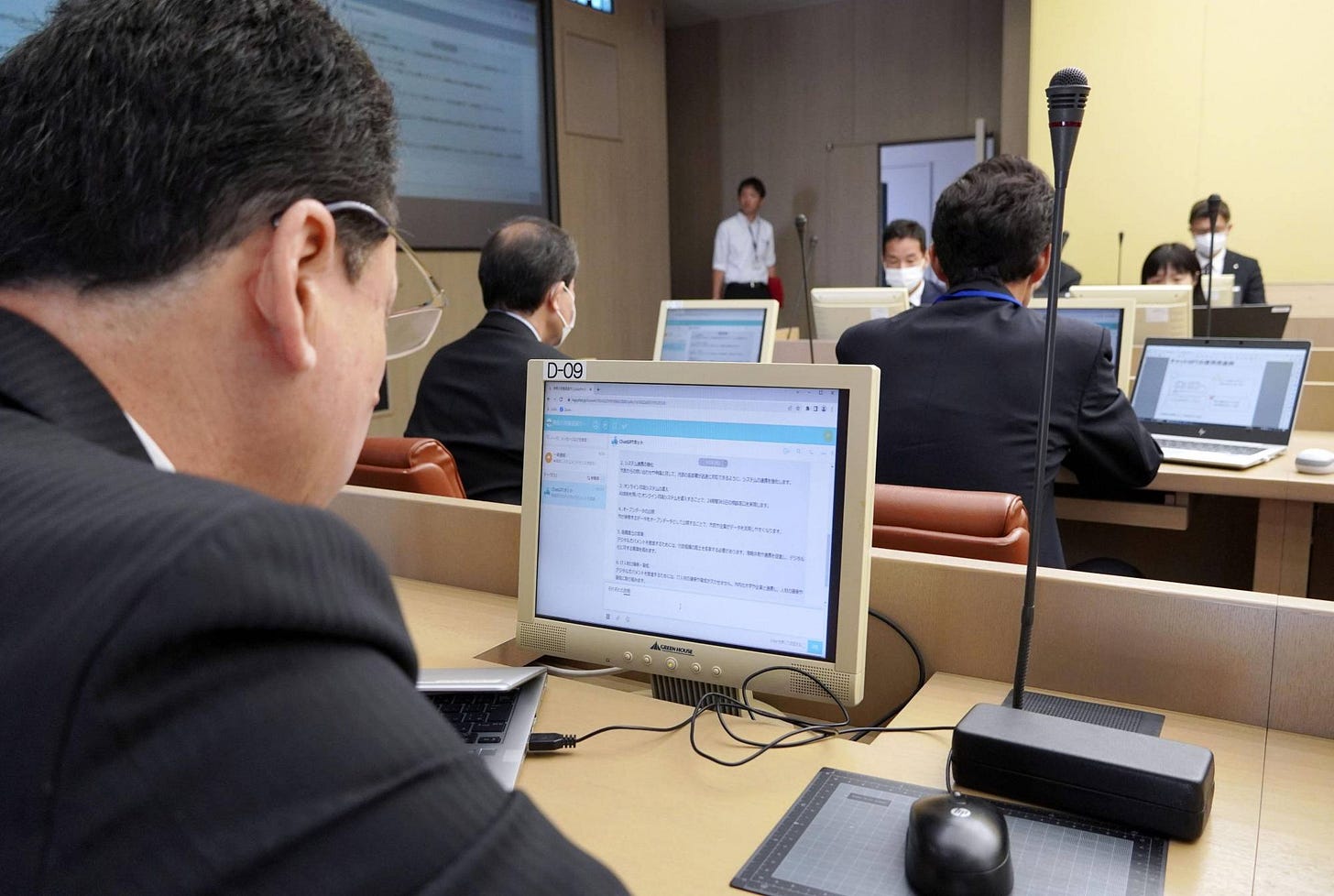 Officials in Yokosuka, Kanagawa Prefecture, check texts using ChatGPT at city hall on Thursday. | KYODO