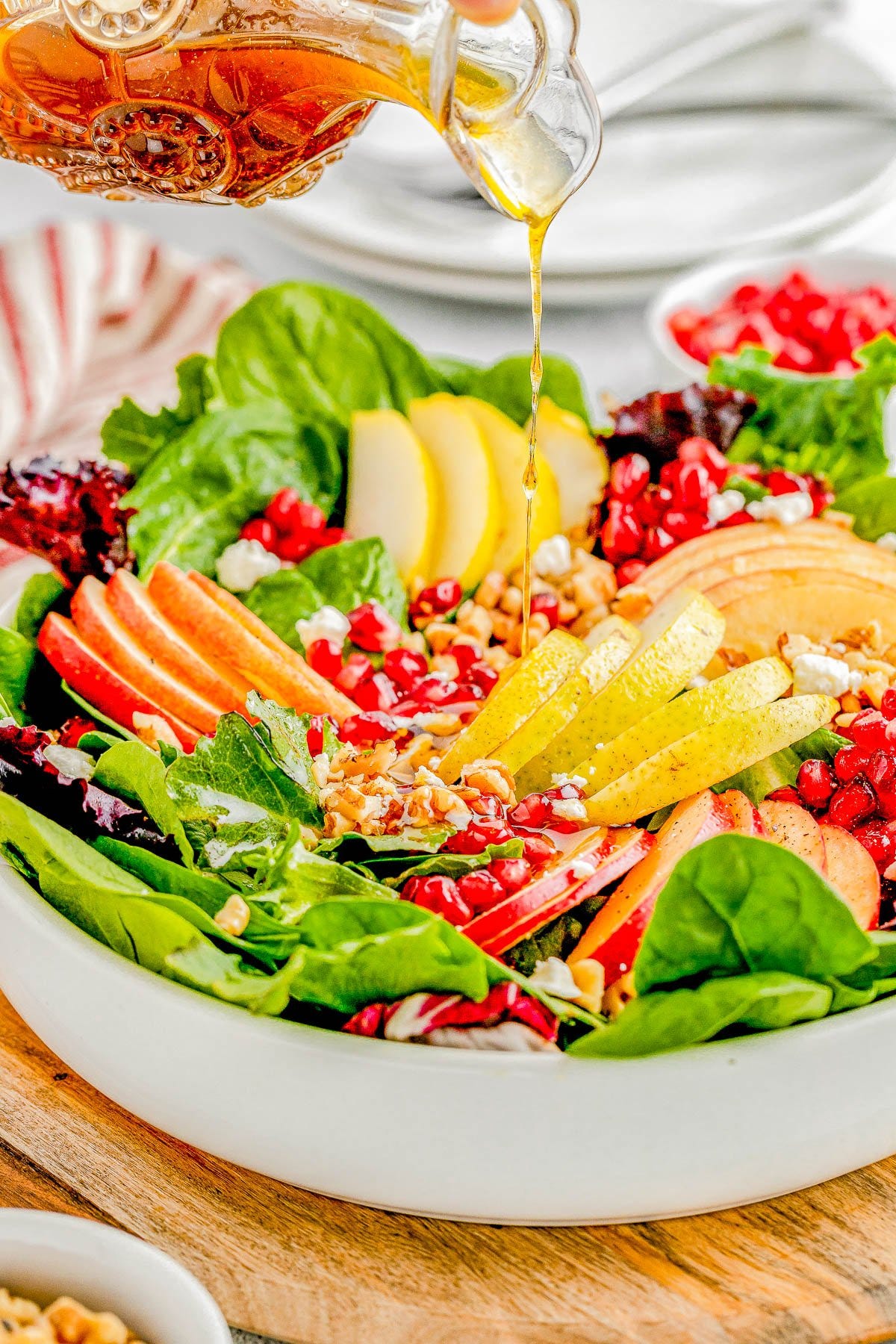 Apple and Pear Salad with Balsamic Vinaigrette - Complete with crisp apples, tender juicy pears, pomegranate seeds, nuts, crumbled feta, and a tangy homemade honey maple balsamic vinaigrette! Whether you're looking for a quick lunch idea, dinner side, or a holiday side dish for Thanksgiving or Christmas, this FAST and EASY salad is sure to get rave reviews!