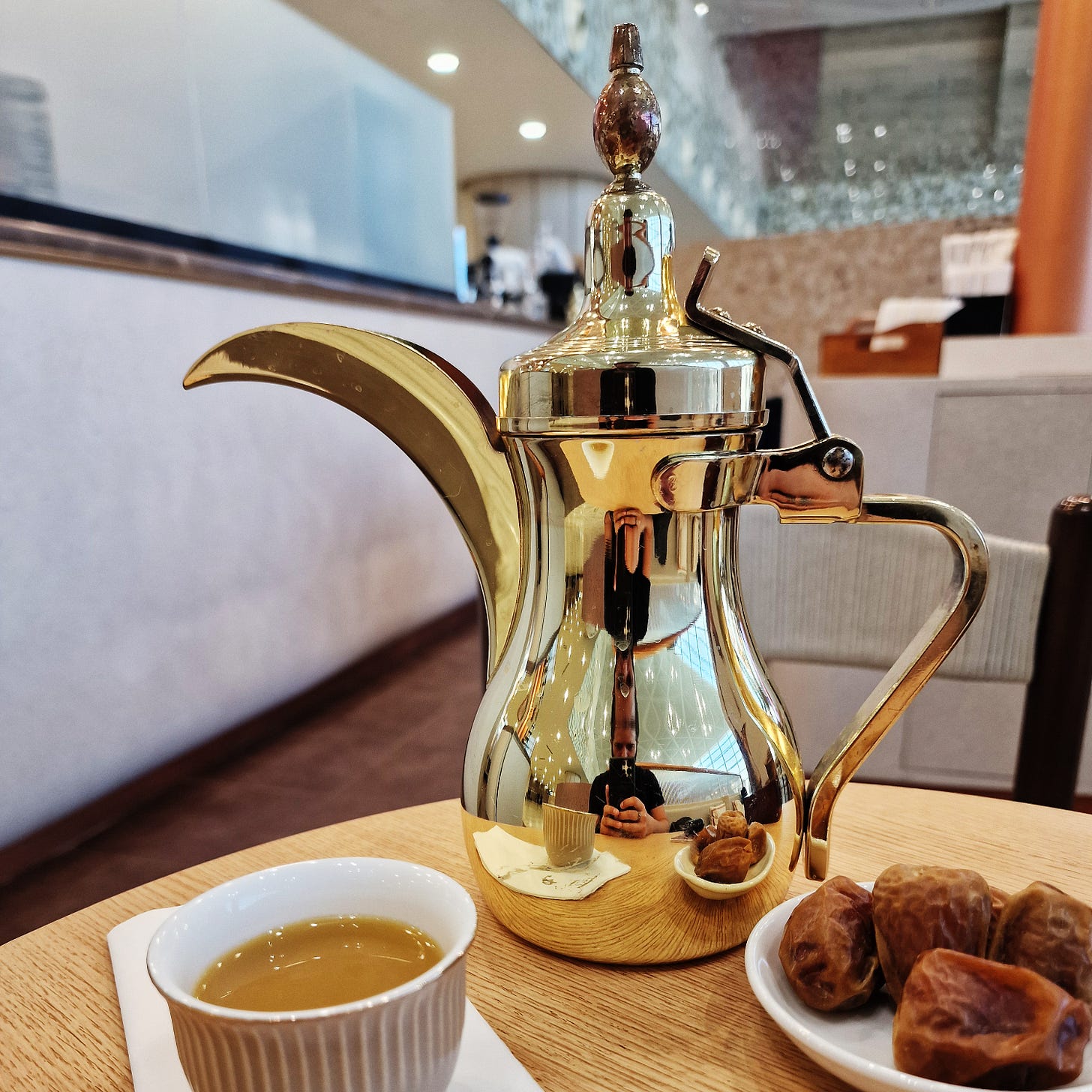 Arabic coffee, or qahwa, is brewed with spices like cardamom and served with dates.