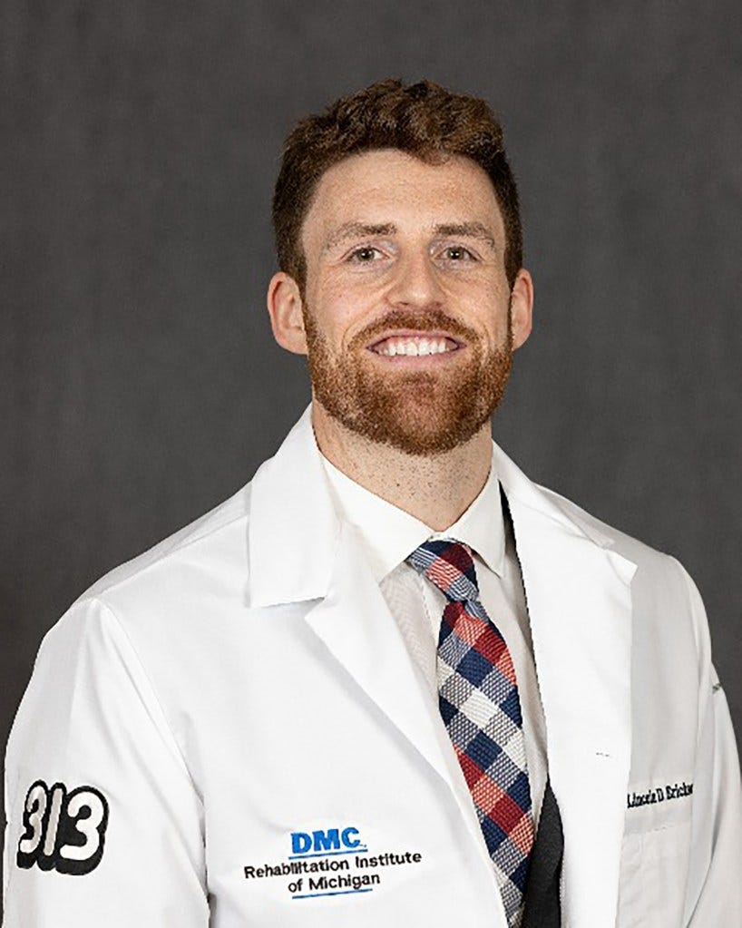 A doctor with a beard in white coat. A doctor with a beard in white coat.