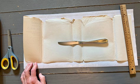 Steps 1-9 described below for how to wrap the Three Cities of Bells dust jacket in a mylar cover