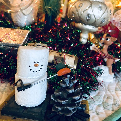 A collection of ornaments and quilted decorations in red, green and sparkling white.