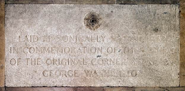 A stone plaque with text

AI-generated content may be incorrect.
