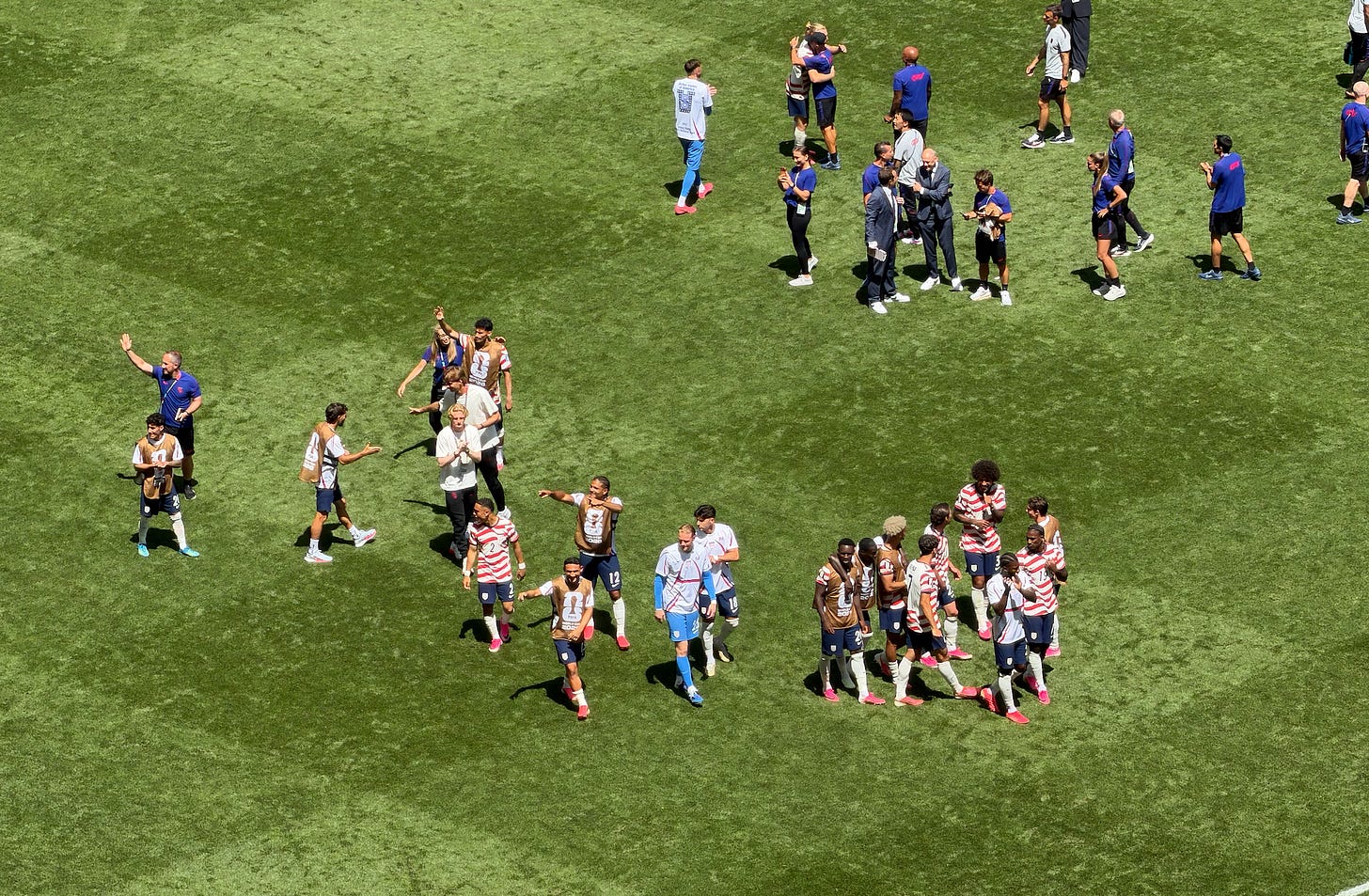 The players celebrating the win at the end of the game. The players celebrating the win at the end of the game.
