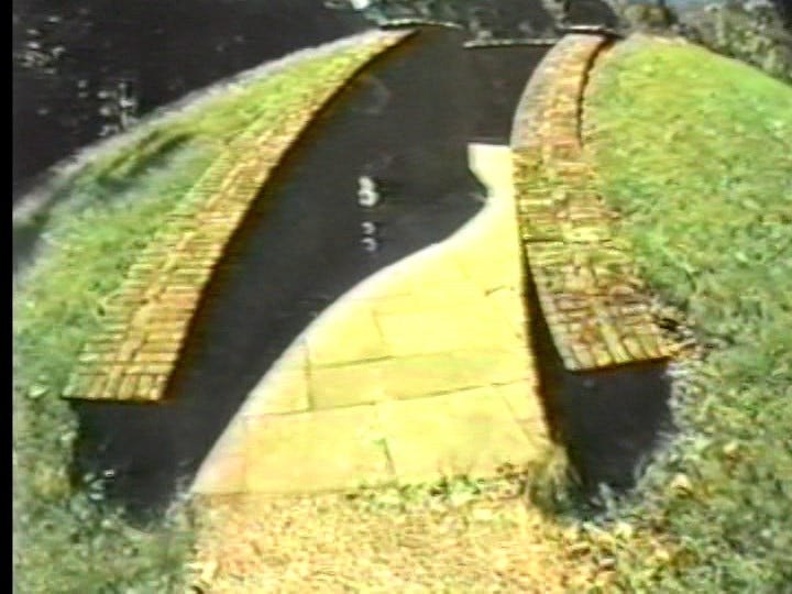 from Peter Rose's Siren: a wide-angle shot of the entrance to a brick labyrinth