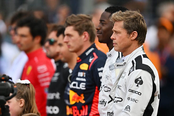 Brad Pitt & Damon Idris taking part in the national anthem at Silverstone.