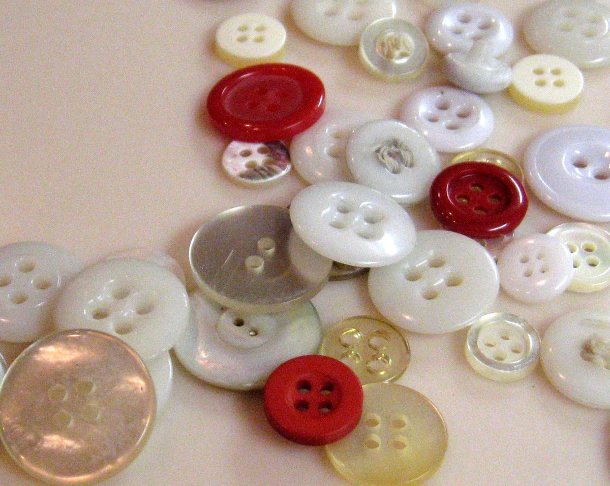 If you have a lot of buttons, sort them by color into different pill bottles. Write the color on the side of the bottle or put a label on it. If you have a lot of buttons, sort them by color into different pill bottles. Write the color on the side of the bottle or put a label on it.