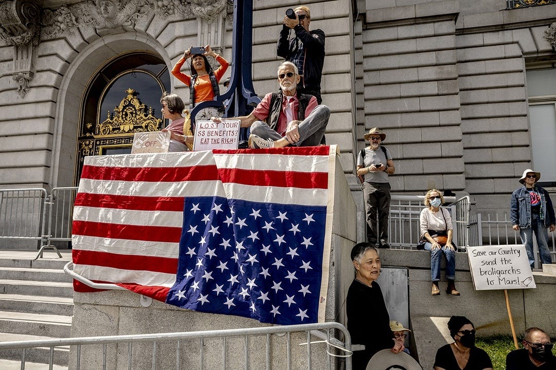 Demonstrators gather outside City Hall in San Francisco on April 5, 2025, as part of the 
