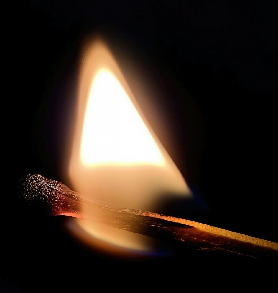 a lit matchstick sitting on top of a table