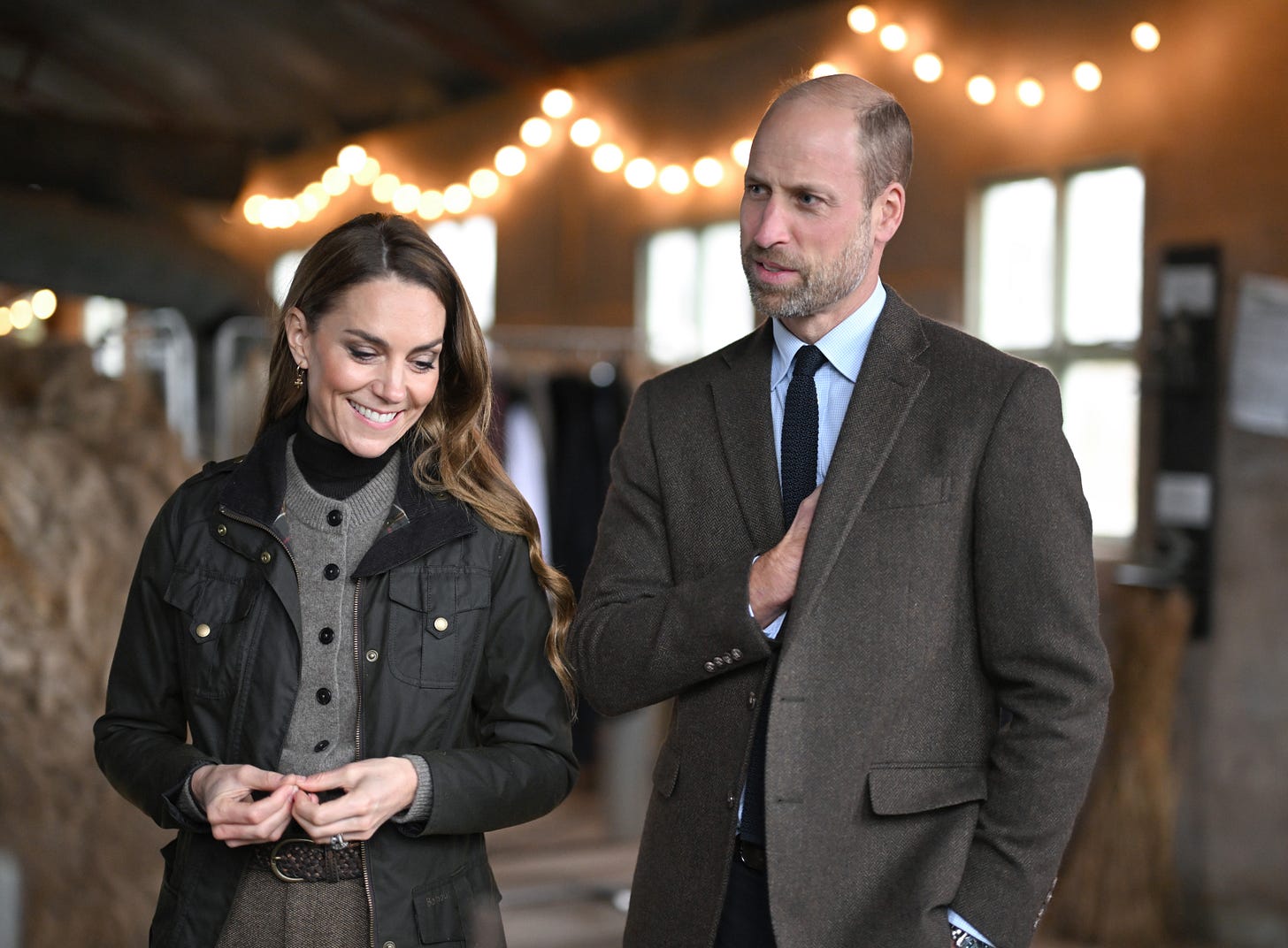 Princess Catherine and Prince William walking and smiling together