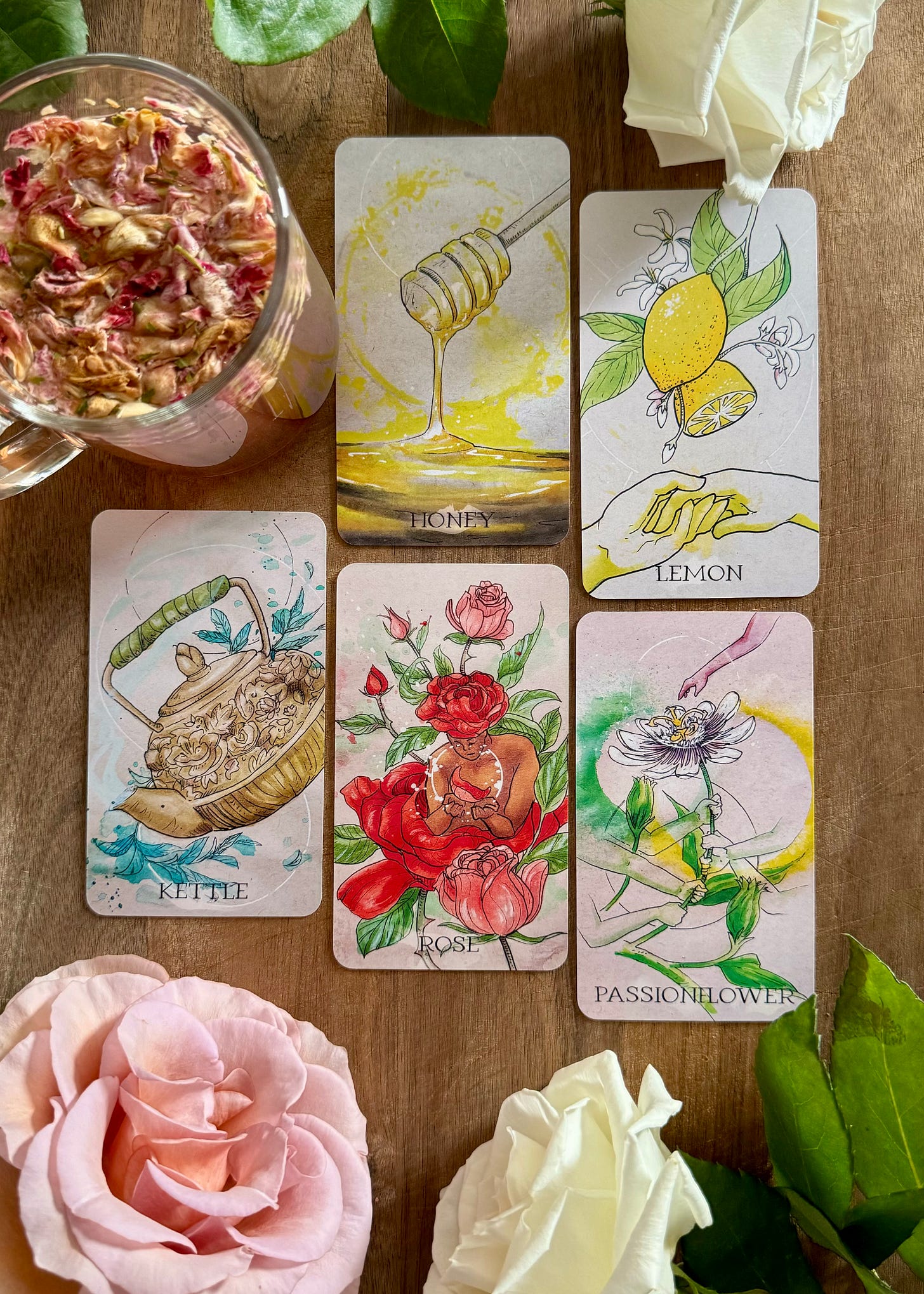 Five cards from the Apothecary Spirits Oracle deck against a wooden background.