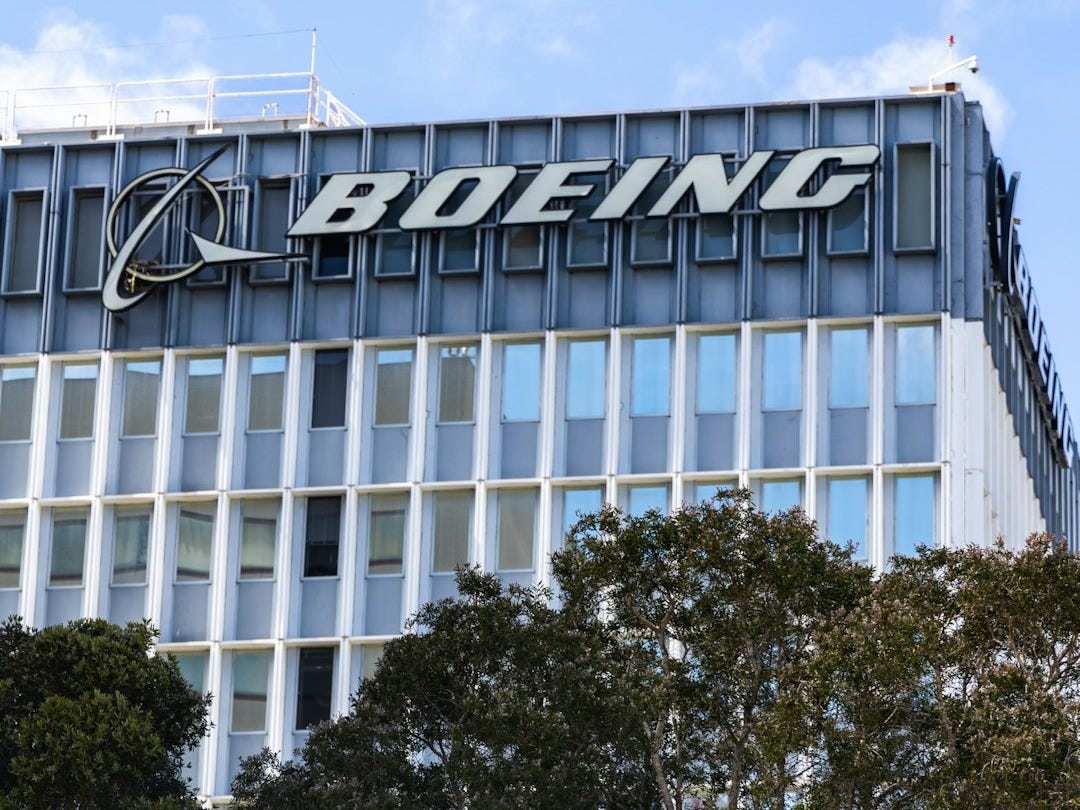 a tall building with a sign on top of it