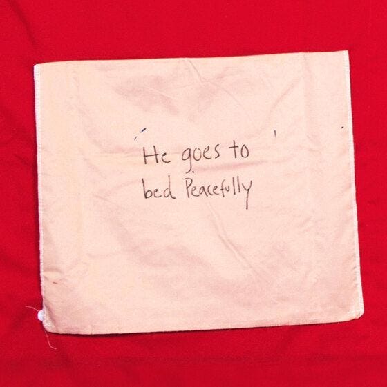 This may contain: a piece of paper with writing on it that says he goes to bed peacefully,