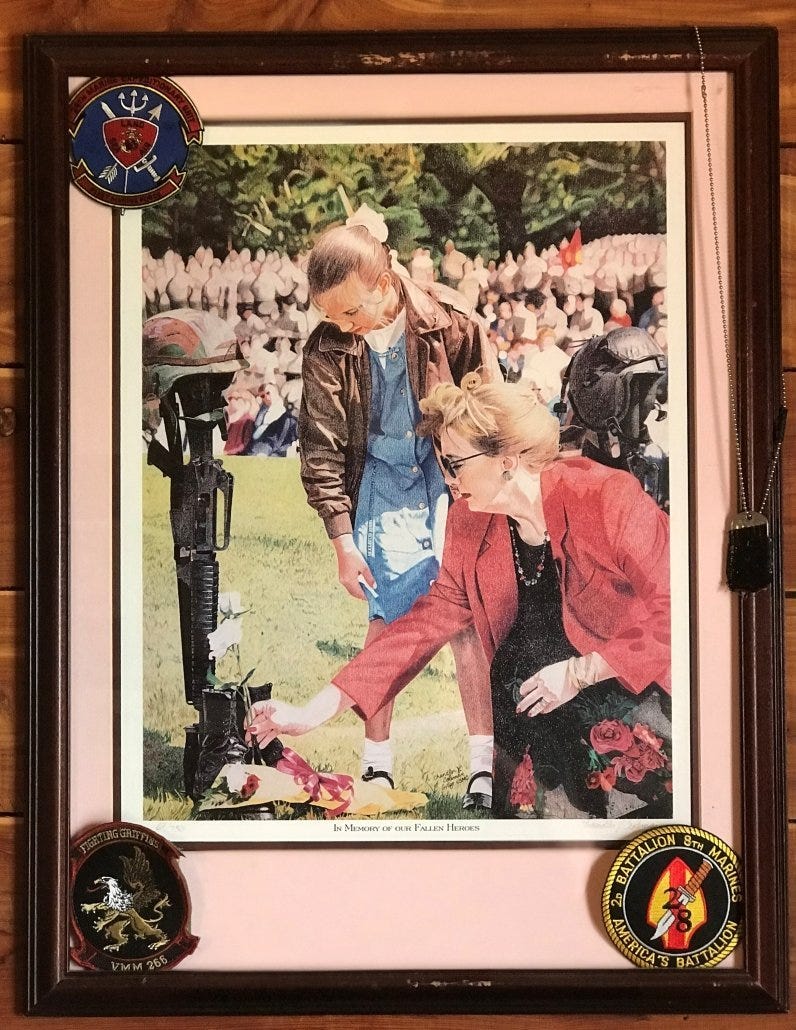 A picture that hangs on Gilpen's wall of Lt. Col. Mick Kuszewski's wife Megan and daughter. 