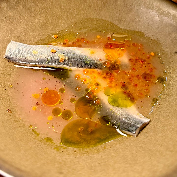 Sardine fillet in broth with chili and herb oil at Masaikuta, Paris 11th