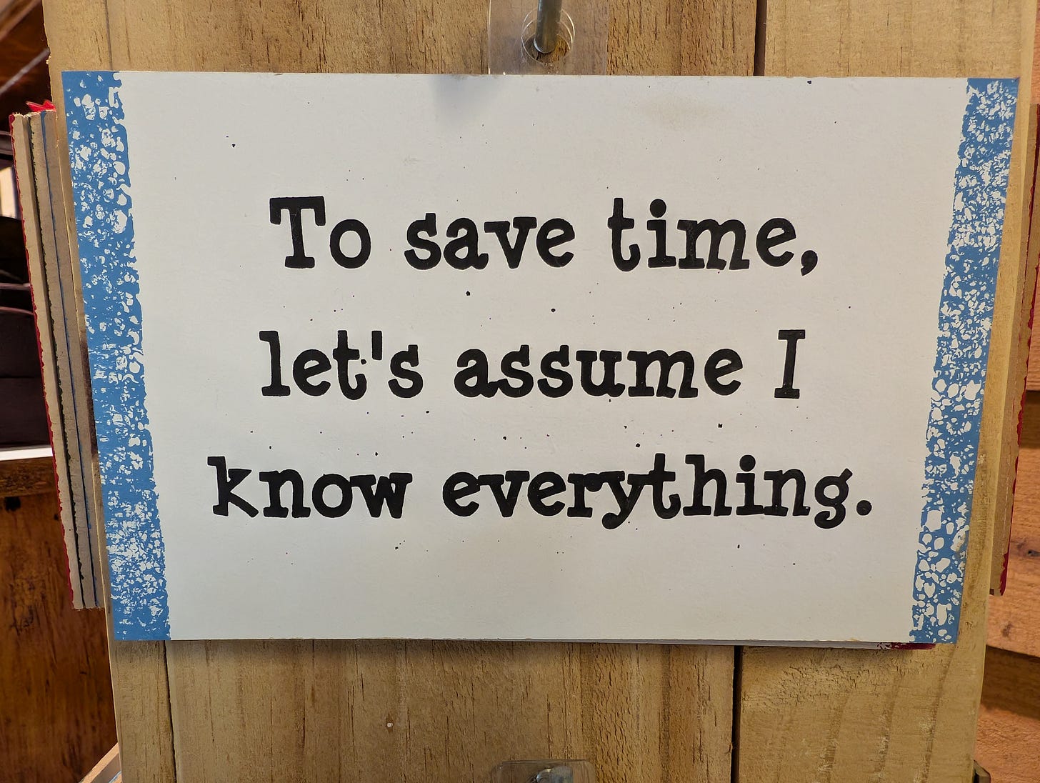 Sign reading "To save time, let's assume I know everything."