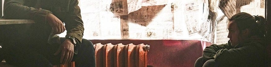 A dude, a radiator, and kid sit in a bar...