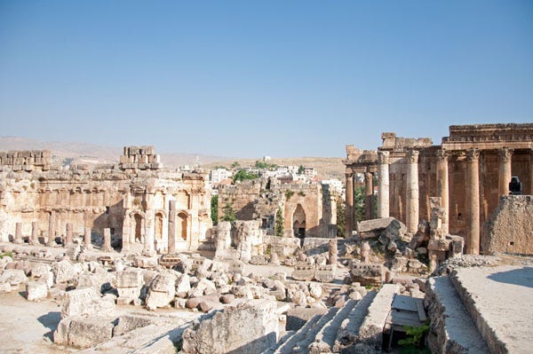 A panorama of ancient Roman ruins bleached white by the sun. A panorama of ancient Roman ruins bleached white by the sun.
