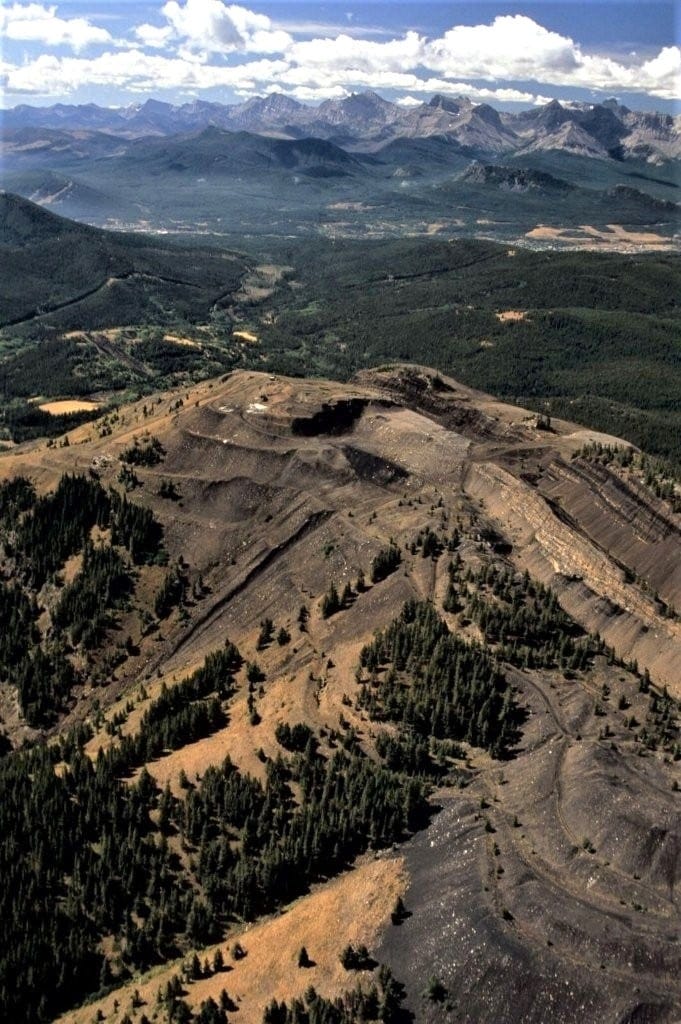 A mountaintop that has been carved into steps by mining.