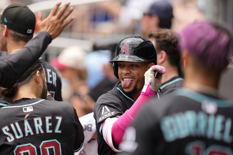 Arizona Diamondbacks second baseman Ketel Marte (4) celebrates his solo homer against the Atlanta Braves in the eighth inning of a baseball game, Thursday, June 5, 2025, in Atlanta. (AP Photo/Mike Stewart)