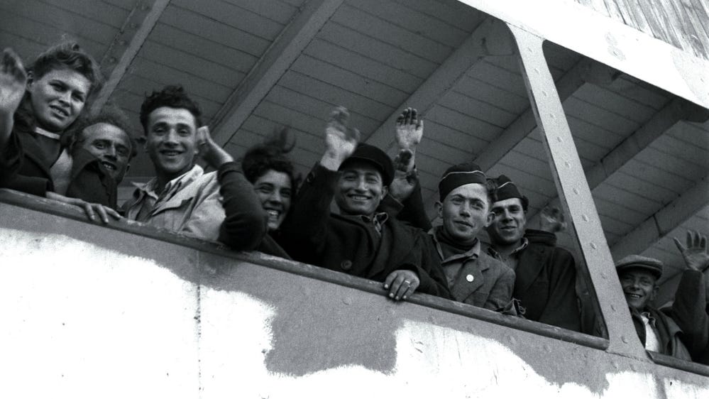 European Jews arrive from the Nazi holocaust wave into the Palestinian Arab city of Haifa, five weeks before Israel is declared a state [Reuters]