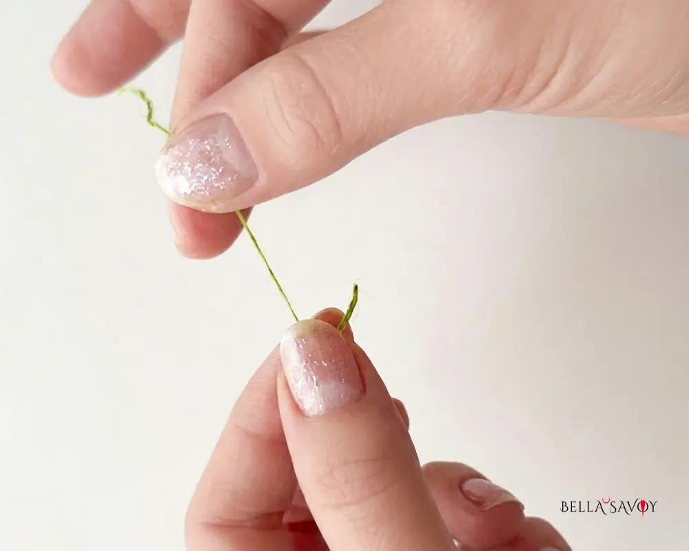 hands separating strands from a skein