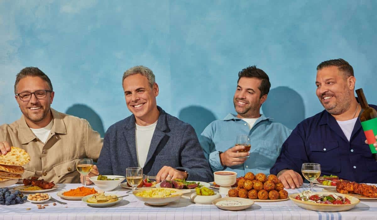CAVA founders sitting at a table.