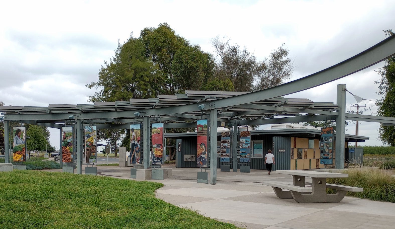 Rest stop on freeway with large display of information panels