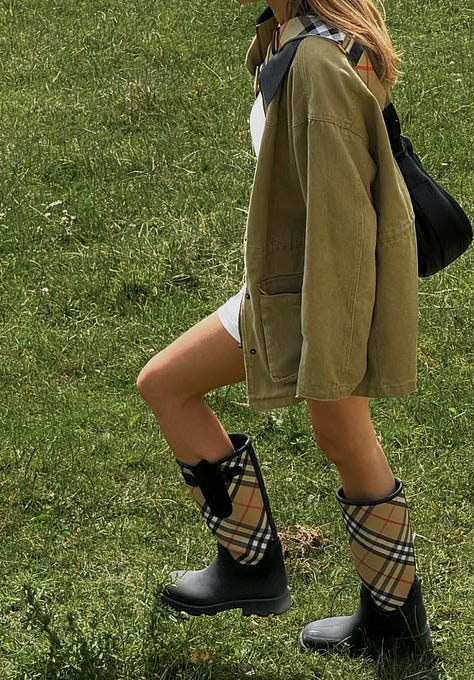 Collage of fall street-style trends: cherry-red jelly flats with white dress; white no-logo sneakers on NYC pavement; cropped boxy jacket; loafers with straight-leg jeans; motor buckle boots under flowy dress; classic beige trench coat.