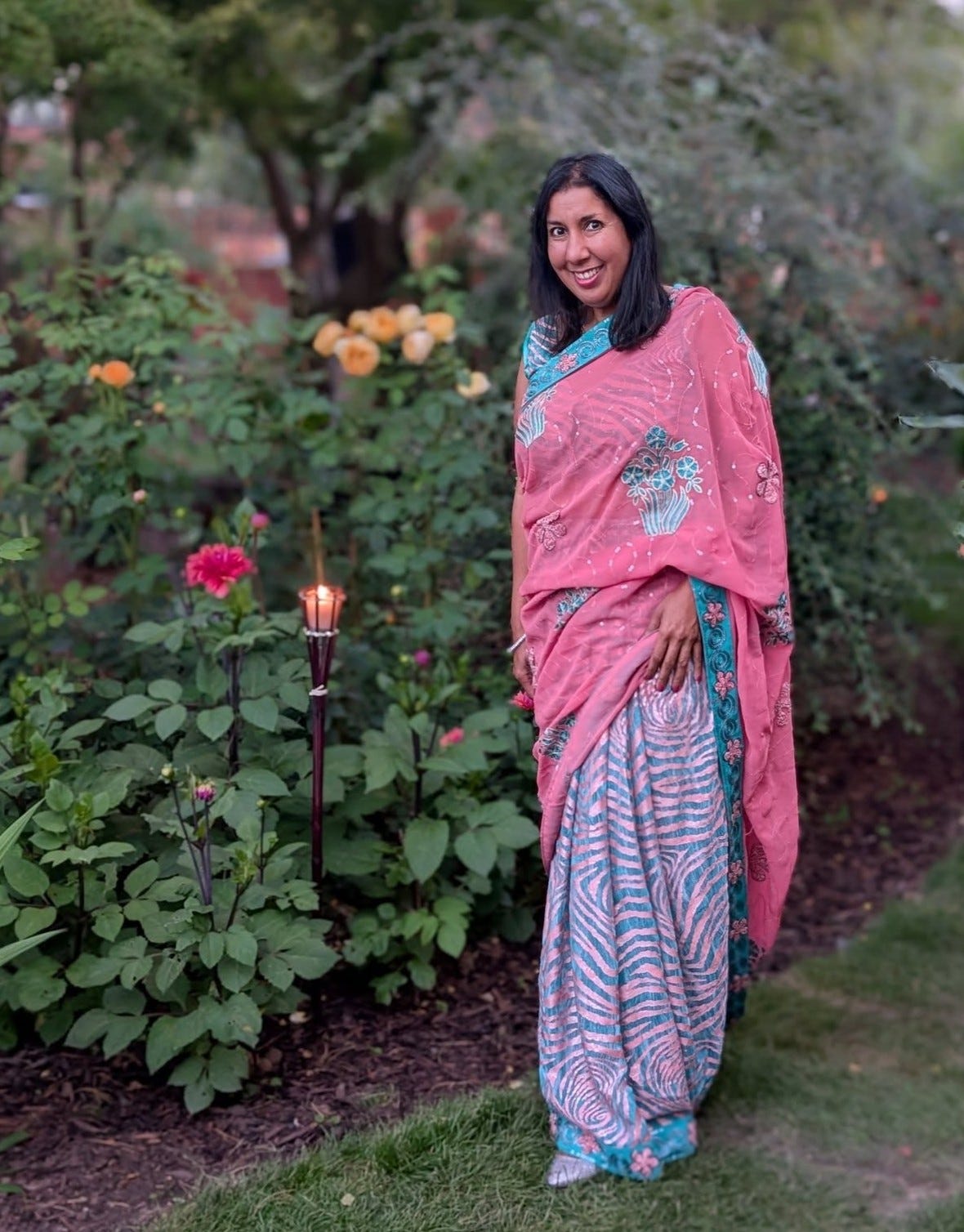 Anj is a midlife British Indian woman. pink and aqua zebra striped sari. Anj is a midlife British Indian woman. pink and aqua zebra striped sari.