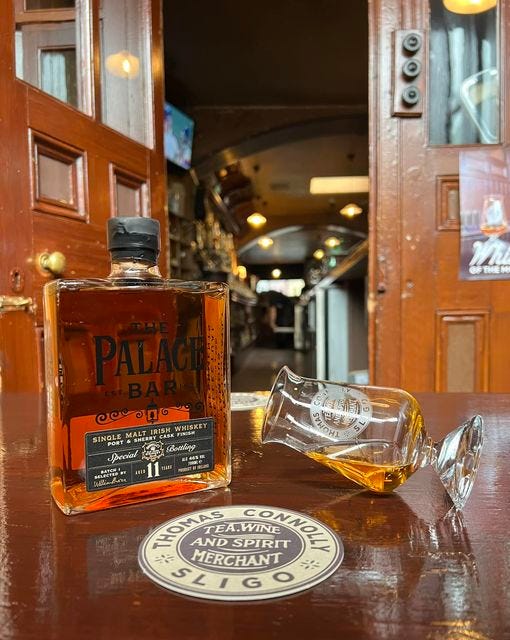 May be an image of fragrance, flask, whiskey and text