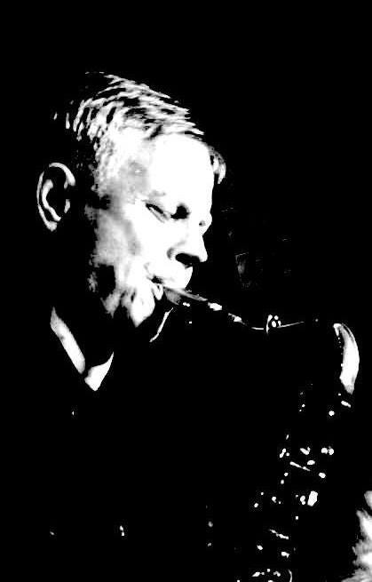 May be a black-and-white image of 1 person, clarinet, trumpet, saxophone and oboe