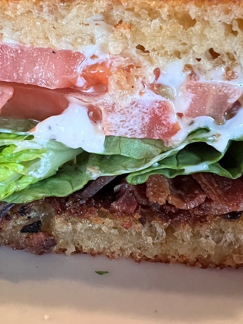 a bacon lettuce and tomatoe sandwich on sourdough bread