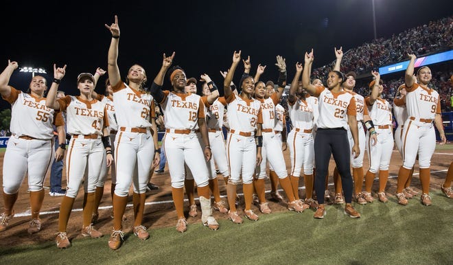June 4: Texas players chant toward the fans after defeating Texas Tech, 2-1, in Game 1 of the Women's College World Series final at Devon Park.