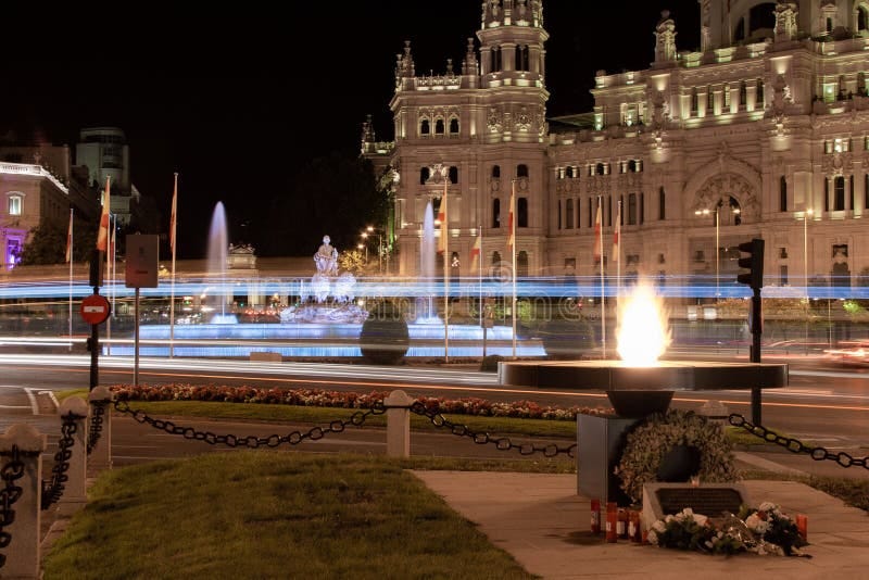 Madrid, Spain; 08/06/2020: Monument in tribute to the victims of Covid-19 consisting of an eternal flame in front of the Plaza de Cibeles and the city hall in Madrid, Spain Madrid, Spain; 08/06/2020: Monument in tribute to the victims of Covid-19 consisting of an eternal flame in front of the Plaza de Cibeles and the city hall in Madrid, Spain