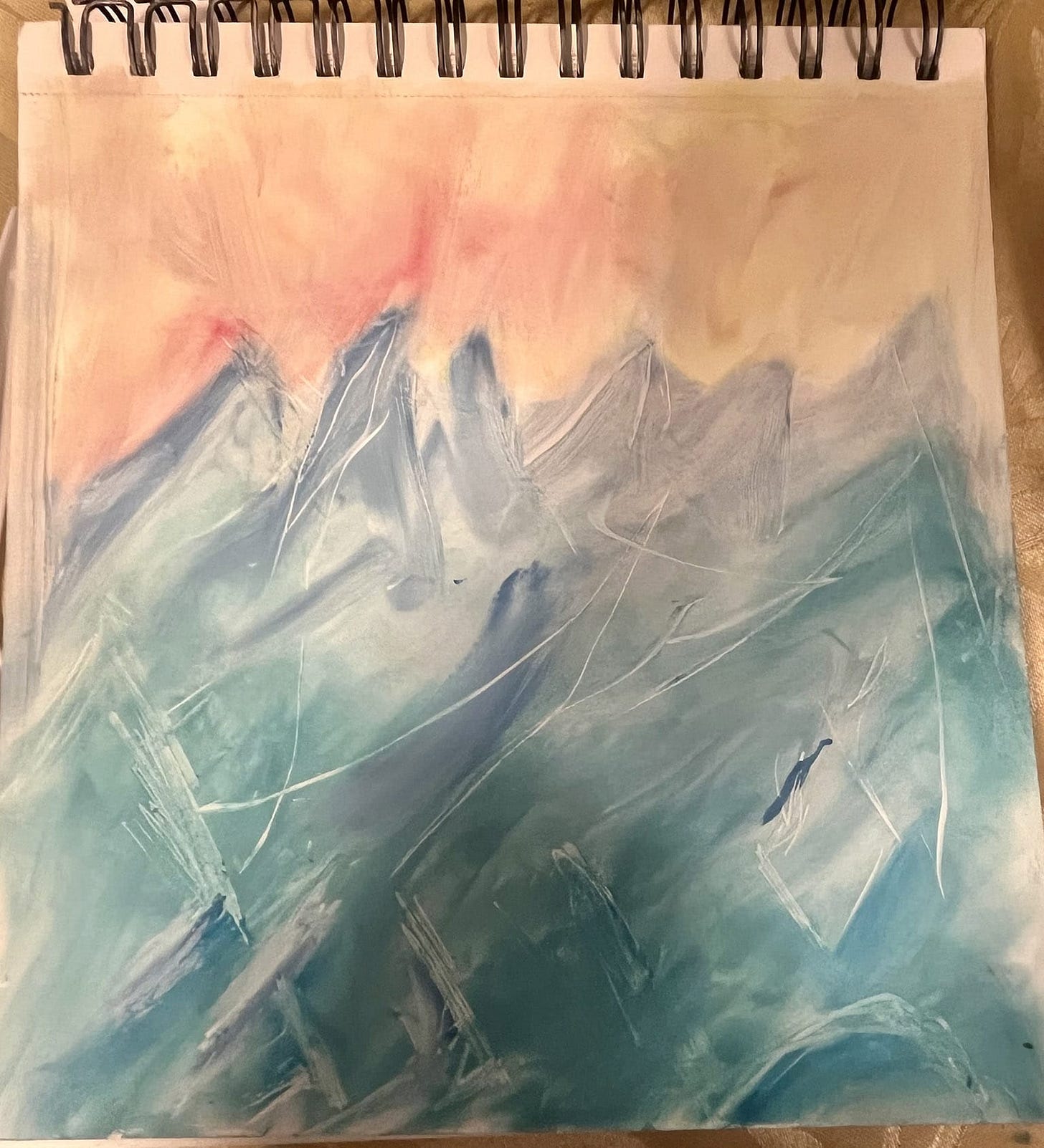Colorful warm sky above ice-cold mountains