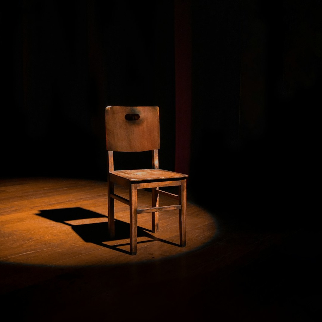 vacant brown wooden armless chair vacant brown wooden armless chair