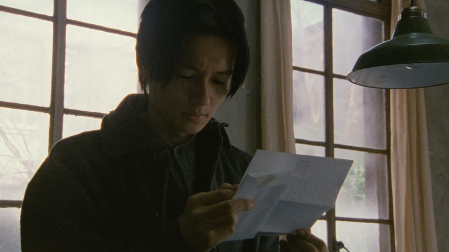 After Life | Still features Arata as Takashi Mochizuki reading a letter.
