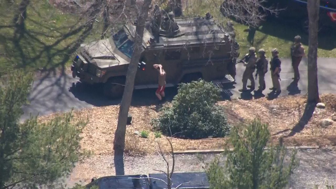 Jack Teixeira is taken into custody Thursday in Dighton, Massachusetts.