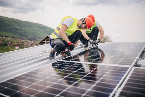 Workers installing solar panels